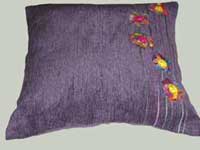 purple cushion with flowers
